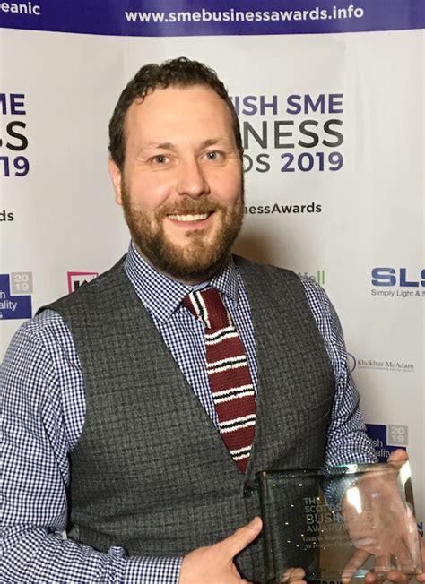 Proud Store Manager Accepts Trophy At Scottish Small Business Awards