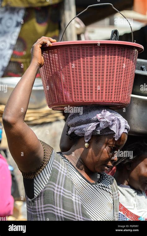 kumasi ghana jan 15 2017 unidentified ghanaian woman carries a basket on her head at the