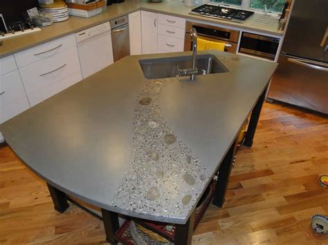 concreate worktop with pebbles | Polished concrete countertop with rock