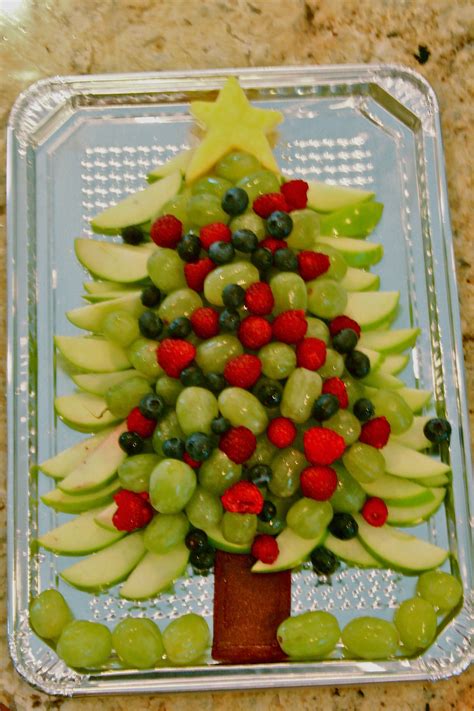 For the first layer of fruit (going from the bottom to the top) add 2 rows of grapes, 1 row of raspberries, 2 rows of grapes, 1 row of blackberries, 2 rows of grapes, 1 row of raspberries, and then 4 rows of grapes. Healthy Christmas TREEt:) | Christmas food, Xmas food ...