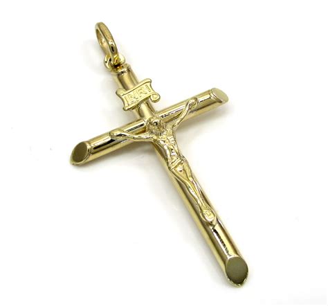 Our gold by shyne cross pendants are the perfect accessory to complete any look! 10k Yellow Gold Small Jesus Tube Cross Pendant
