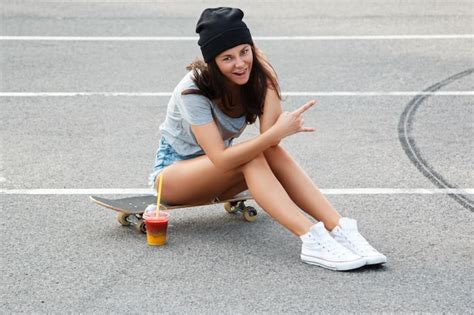 Premium Photo Sexy Girl Sitting On The Skateboard