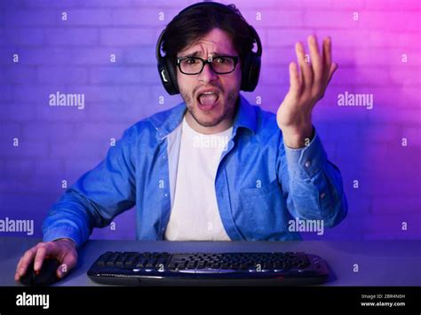 Angry Gamer Losing Game Playing Online On Computer At Home Stock Photo