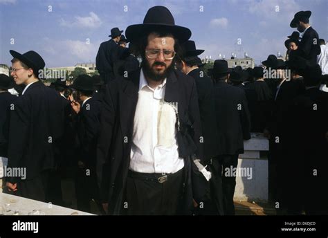 Ultra Orthodox Jew With Ripped Clothes As A Gesture Of Mourning At A