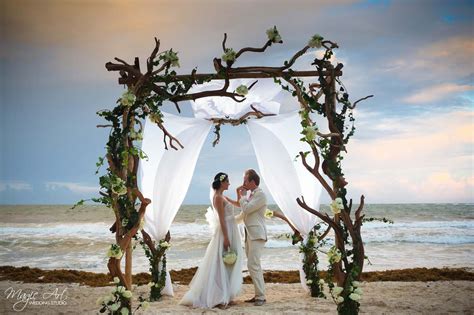 Bride And Groom Beach Portraits Under Rustic Twig Wedding Arch Tulum