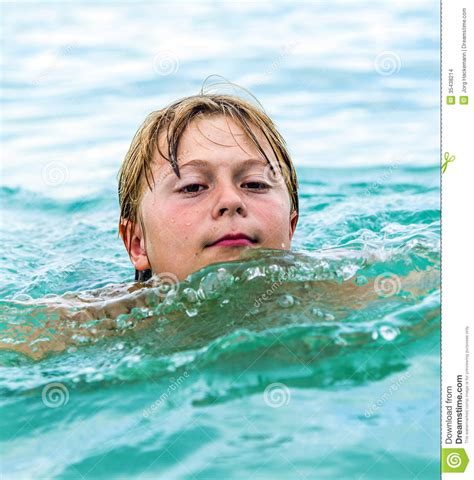 Smiling Boy Swimming In The Ocean Stock Photo Image Of Positive