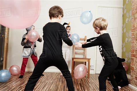 Children Playing With Balloons At Birthday Party Stock Photo Dissolve