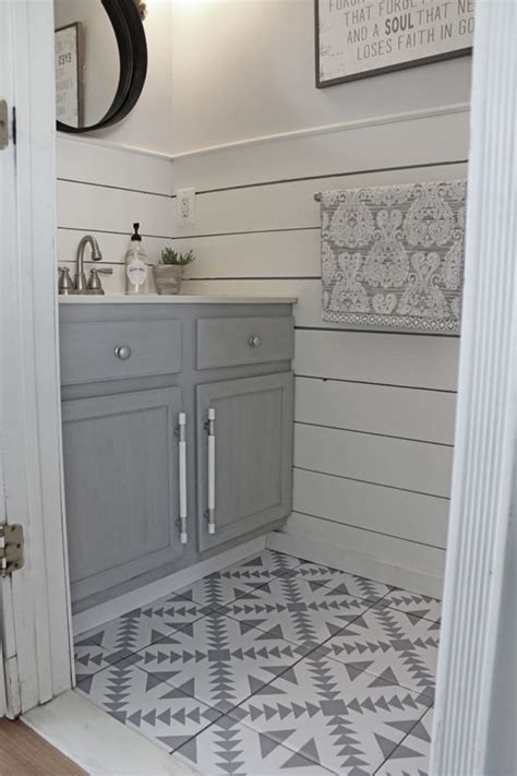 Honestly, laminate flooring will be the best option over the hardwood flooring for your bathroom. Floor Stickers in The Bathroom! - The Honeycomb Home