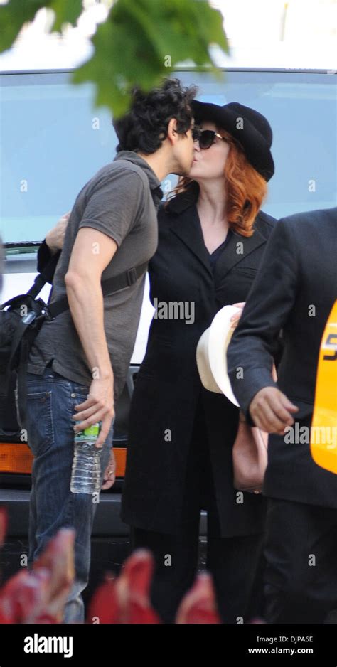 Christina Hendricks And Husband Geoffrey Arend Share A Kiss Outside Of Their Manhattan Hotel New
