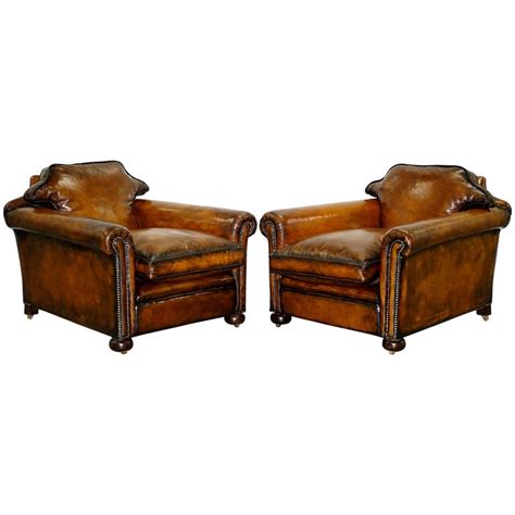 This is a stunning looking armchair, with a great shape & very comfortable too. Pair of Restored Victorian Brown Leather Club Armchairs ...
