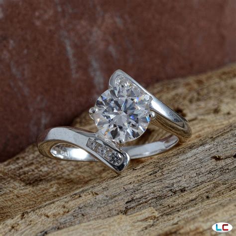 Simulated Diamond Bypass Ring in Platinum Overlay Sterling Silver