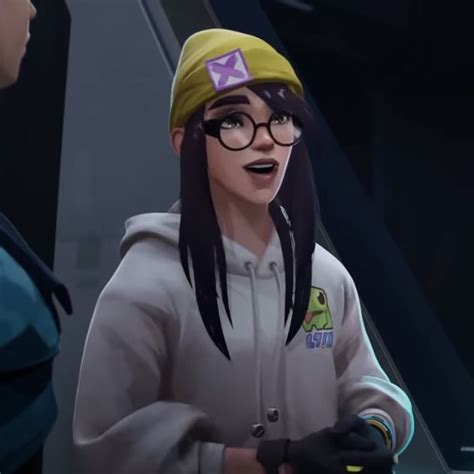 An Animated Image Of A Woman With Glasses And A Beanie Talking To Another Woman