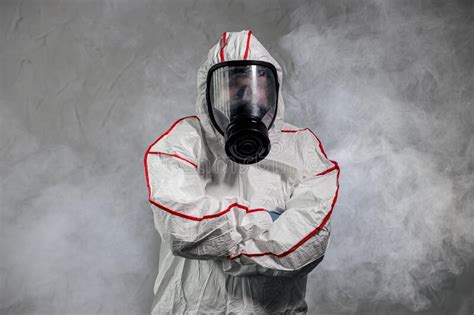 Male In Protective Hazmat Suit And Gas Mask Pathogen Respiratory