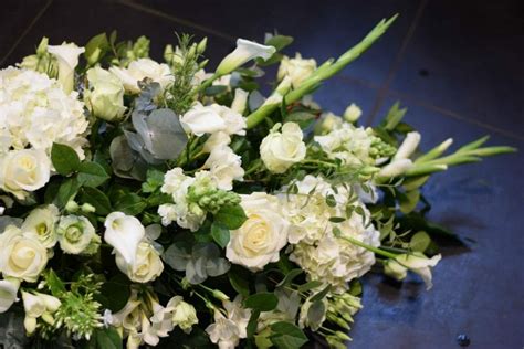Lilies are symbolic of the soul of the departed and the hope offered by the renewal process. Funeral Flowers Spray Arrangement | Kensington Flowers