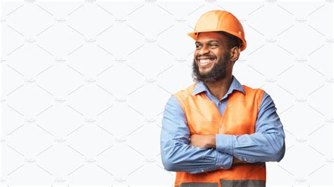 Happy African Builder Standing Pleas Background Stock Photos