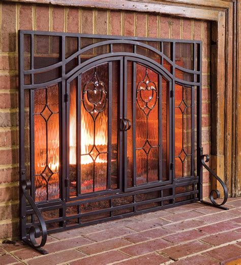 Keep in mind it's made of firewood, so move it far away before you light your fireplace. Small Two-Door Fireplace Screen with Glass Floral Panels ...