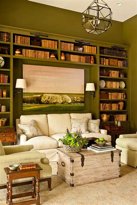 This living room offers plenty of storage space for books, between the two bookcases and the area underneath the coffee table, yet also gives visitors plenty of other gorgeous things to look at. Southern Living Idea House