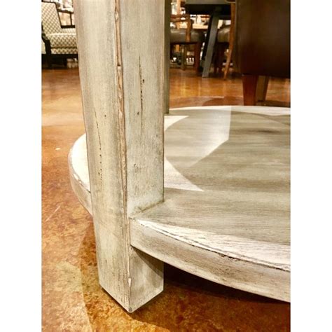 This round end table features a concave metal base with a small glass shelf for the display of small items. Drexel Heritage Jule Off-White Antique Wood & Stone Top ...