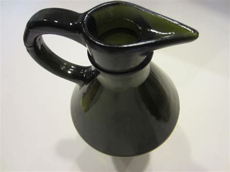 Amber Glass Pitcher Vetreria Etrusca For Sale | Antiques ... It also has a 20 point star base and measures 9 3/4 tall and is 7 1/4 spout to handle.