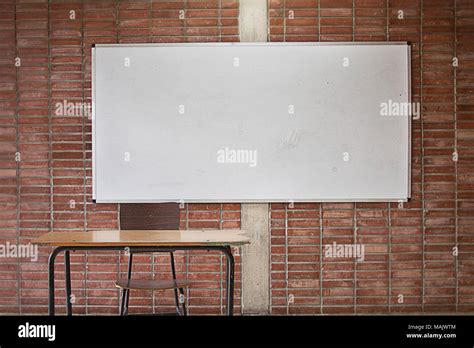 Empty Teacher`s Desk With Whiteboard In The Background No Teacher No