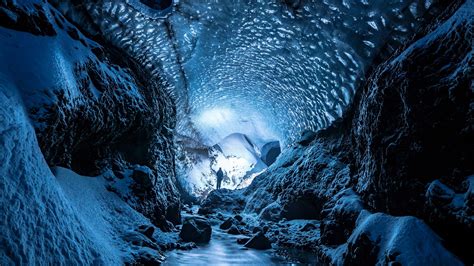 Download Wallpaper 2560x1440 Glacier Cave Man Ice Snow Widescreen