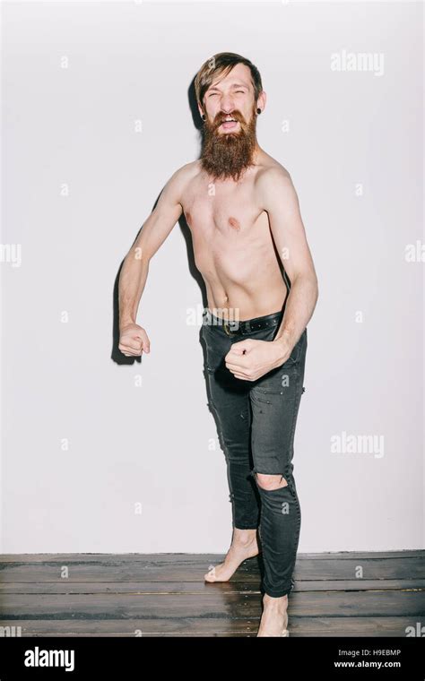 Skinny Shirtless Man Flexing Stock Photo Alamy