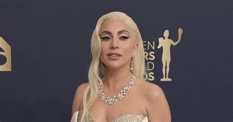 Lady Gaga Dazzles In Jaw Dropping White And Gold Plunging Gown At The