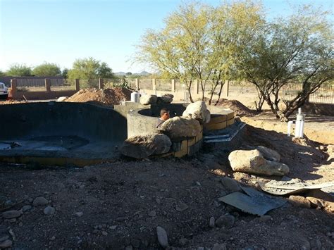 Bathtub services at bathtub installation guys in wyoming. Rock boulder installation around the hot tub | Backyard ...