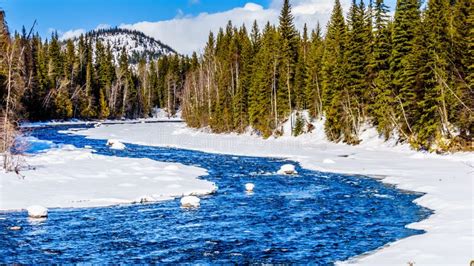 Snow And Ice Lining The Murtle River In Winter Time In The Cariboo