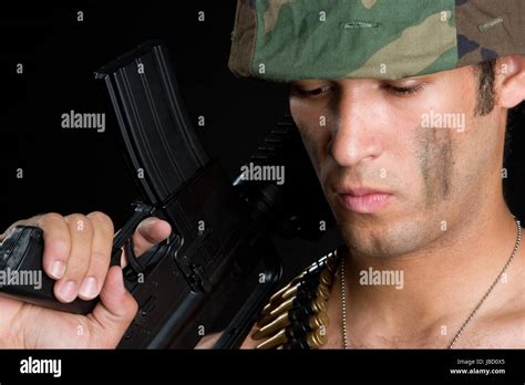 Military Man Holding Gun Stock Photo Alamy