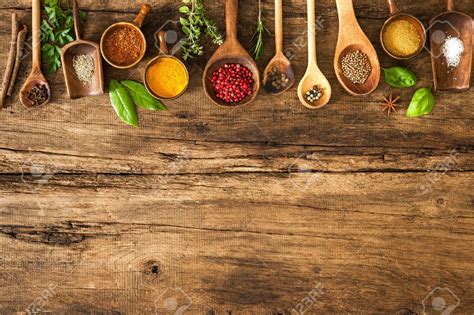 Various Colorful Spices On Wooden Table Stock Photo Picture And