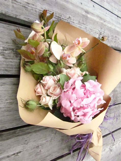 Bouquet Of Flowers Wrapped In Paper Different Colors High Quality