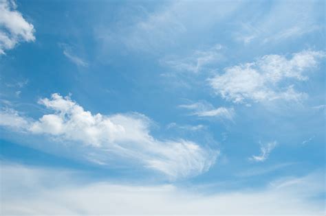 Abstract White Wispy Clouds And Blue Sky In Sunny Day Of