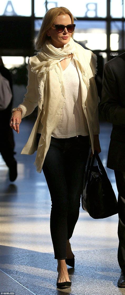 Her performance in the musical moulin rouge! Nicole Kidman looks chic in cream as she jets out of Los ...