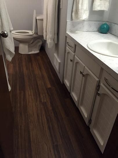 Trafficmaster is one of the world's best laminate flooring sold by home depot. TrafficMASTER Allure Ultra 7.5 in. x 47.6 in. 2-Strip Black Walnut Resilient Vinyl Plank ...