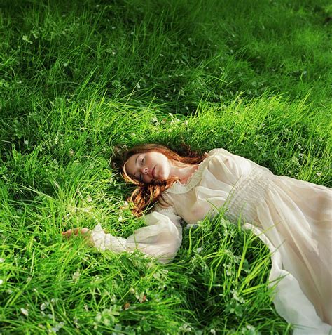 Woman In Dress Lying Down On Grass Photograph By Lisa Kimmell Lying