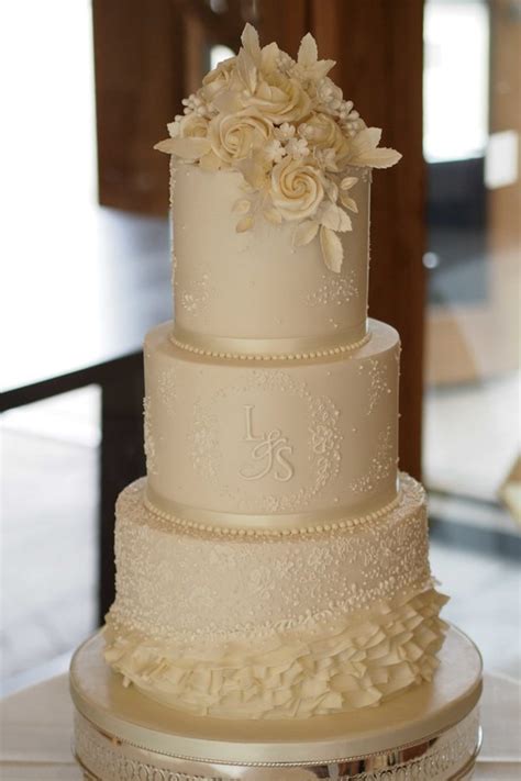 Ivory Wedding Cake With Lace Design And Monogram The Frostery