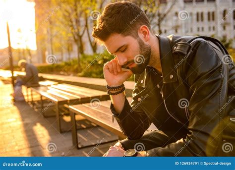 Young Man Sitting On A Bench Stock Image Image Of Male Flare 126934791