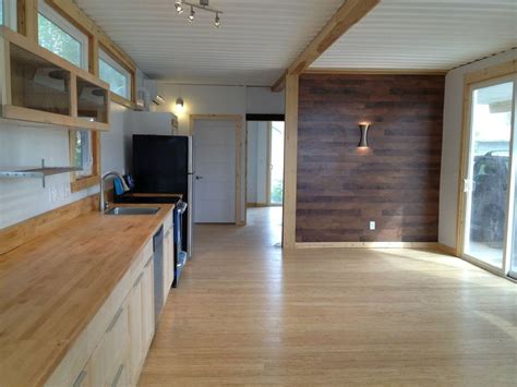 The 3 bedroom housing unit is designed using 3 40 foot containers placed in parallel to each other to create floor plan layout | sheltermode homes. Looks Are Deceiving at this Eco-Friendly Shipping ...