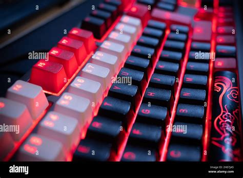 Red Backlit Mechanical Keyboard With Black White Red Keycaps At An