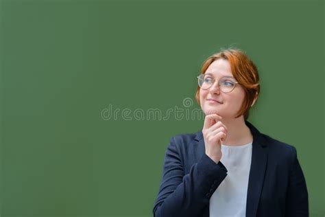 The Teacher Stands Next To An Empty School Blackboard Copy Space For
