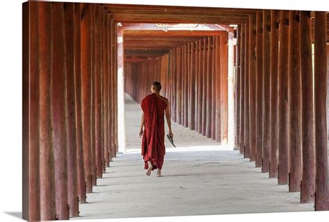 Monk In Walkway Of Wooden Pillars To Temple Salay Myanmar Wall Art
