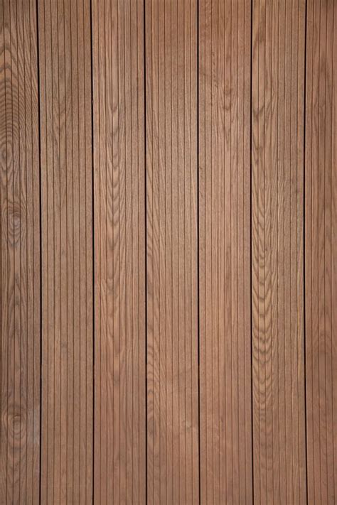 Wood Paneled Wall With Vertical Planks In The Center And Bottom Part