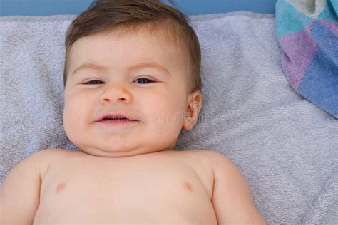 Baby Boy Naked Smiling Laying Down On A Towel On A Sun Bed Stock Photo Image Of Nursery Hair