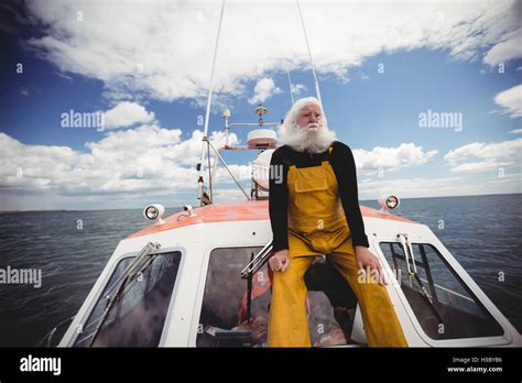 Fisherman Sitting On Deck Stock Photo Alamy