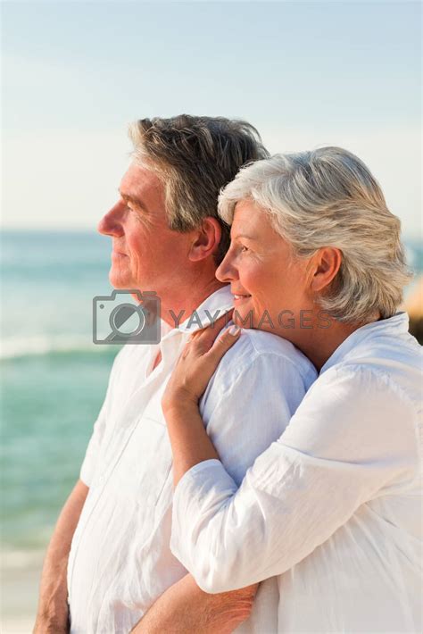 Woman Hugging Her Husband At The Beach By Wavebreakmedia Vectors