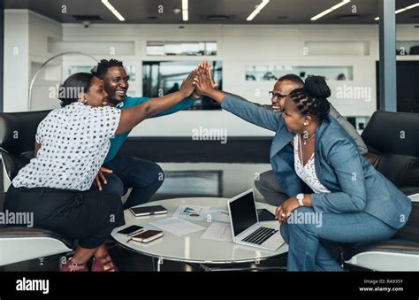 Friendly Successful All African Business Team Give High Five Together
