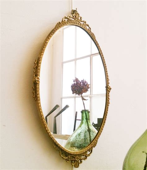 Miroir ovale ancien en métal doré - Luckyfind