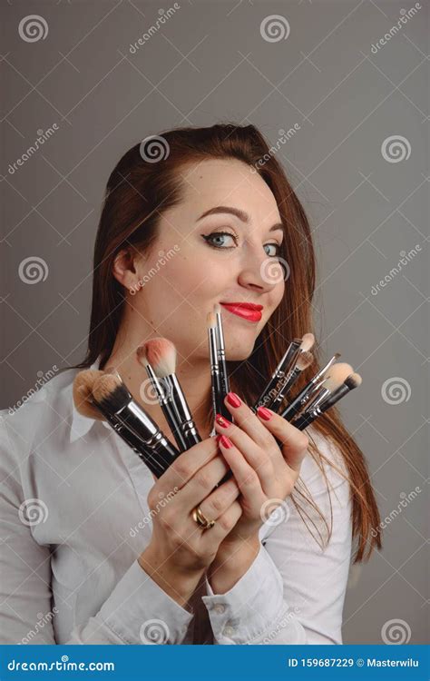 Woman Holding A Set Of Cosmetic Brushes For Make Up Stock Image Image