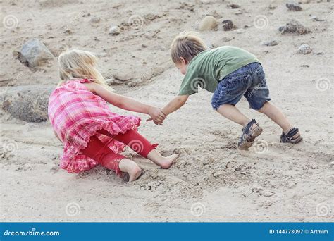 One Child Helping The Other Child Help Concept Stock Image Image Of